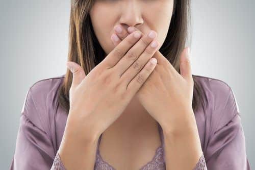 Woman Covering Her Mouth with her hands