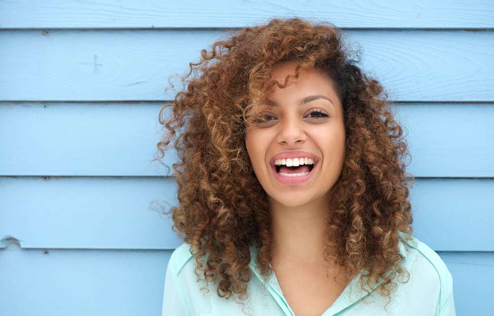 Young woman smiling and laughing