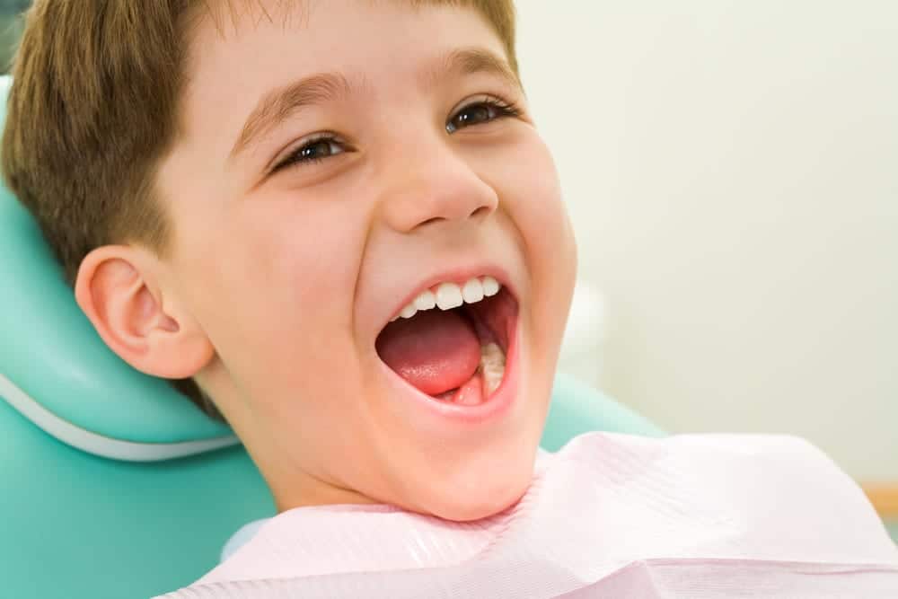 Little-boy-at-dentists-office-smiling